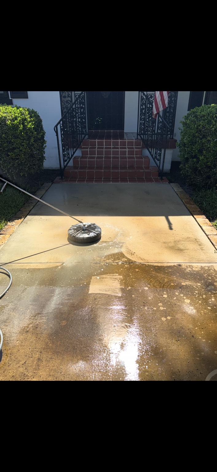 Concrete pressure washing in progress from a Last Call project